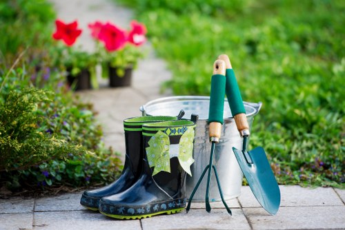 Gardening contractor assessing a property before carrying out agreed maintenance tasks